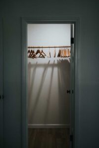 standard closet before custom closet system added