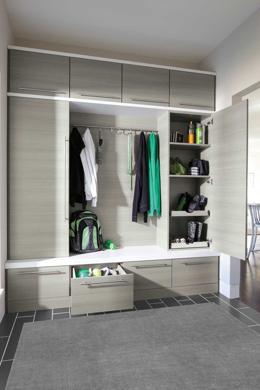 entryway storage in mudroom storing outdoor gear with custom closet solutions in Denver