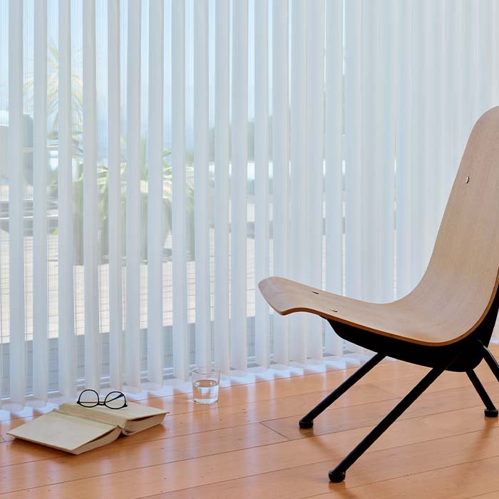 sheer vertical shades with light filtering on wide window opening