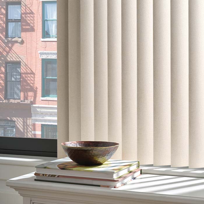 vertical blinds on larg windows in living room