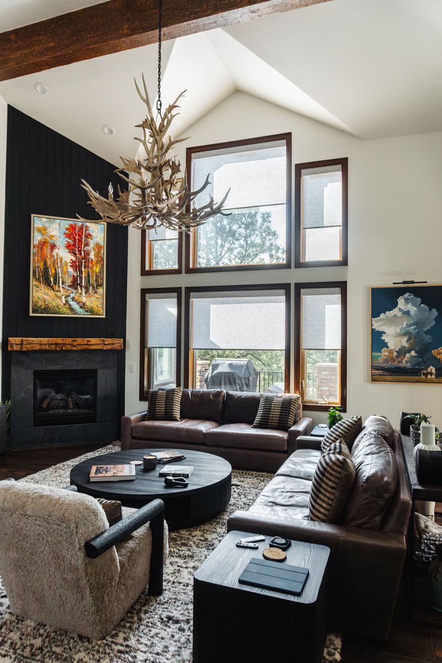 motorized roller shades on wall of windows in living room for light filtering to reduce glare