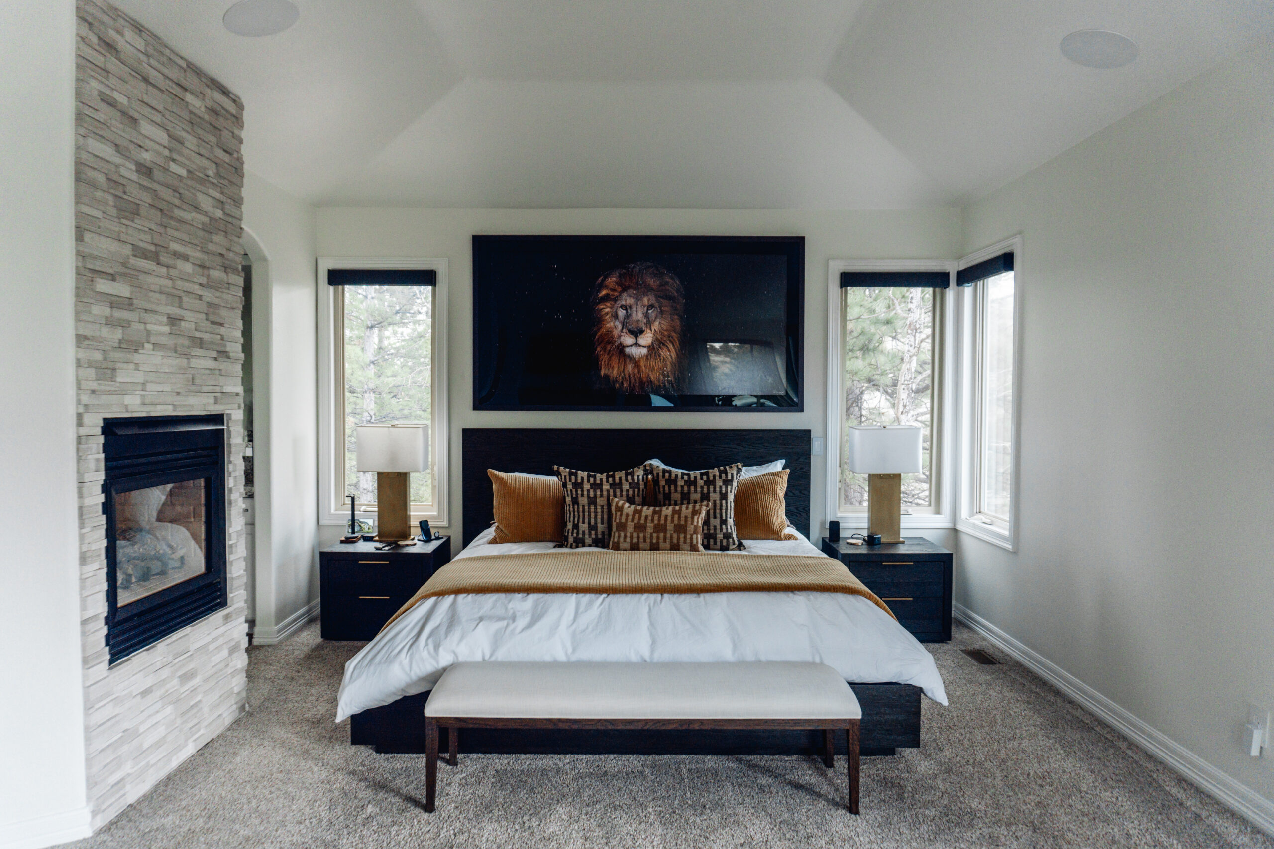 Motorized roller shades raised to allow natural light into bedroom during daytime