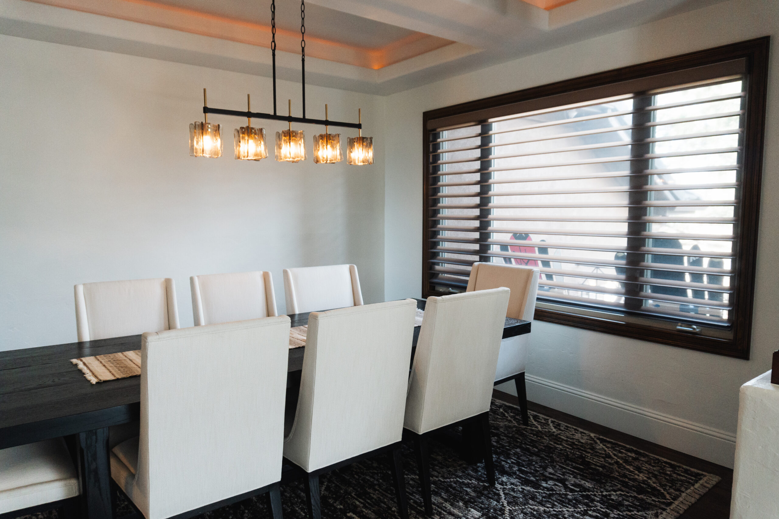 Silhouette window shades installed in dining room providing privacy and soft natural light