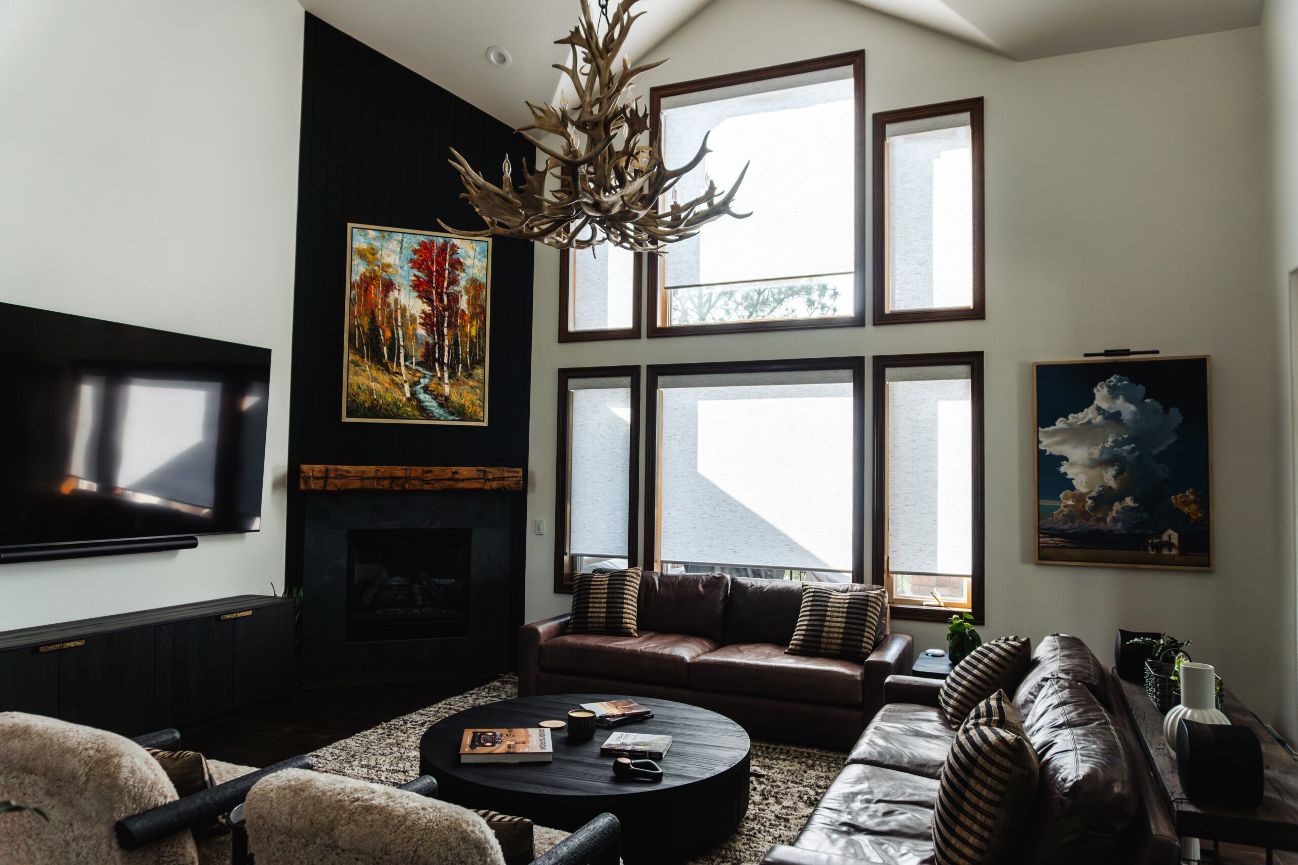 Motorized Designer Roller Shades installed on large family room windows for glare control and privacy