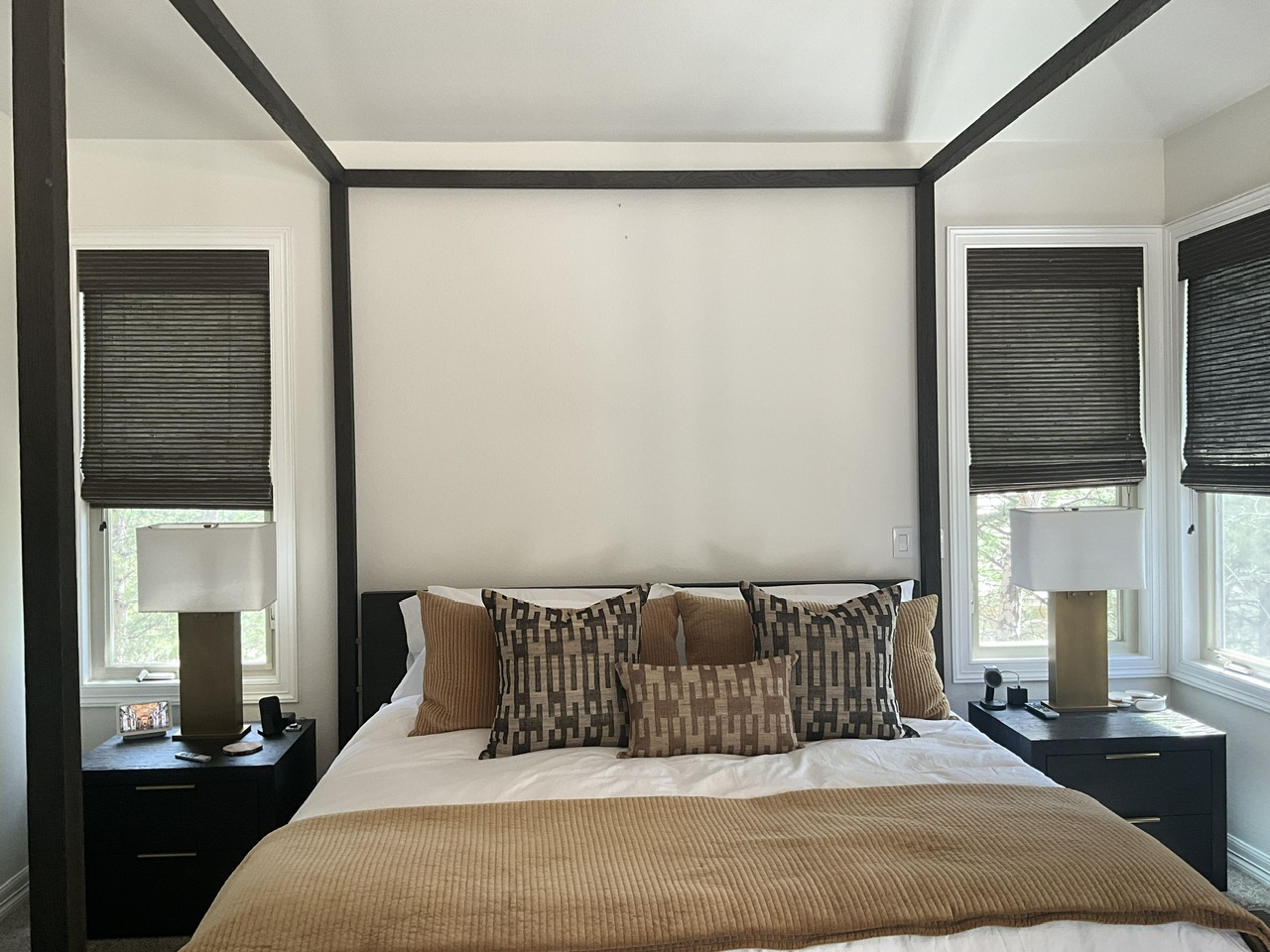 Bedroom before roller shade installation with limited room darkening