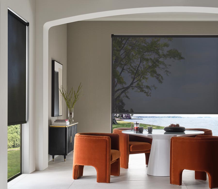black-hunter-douglas-designer-screen-shades-for-large-windows-in-modern-dining-room-rocky-mountain-shutters-shades-and-closets dining room with black window covering shades with orange chairs
