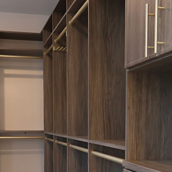 cottage-color-closet-system-rocky-mountain-shutters-shades-closets Custom walk-in closet with built-in shelving, drawers, and hanging storage