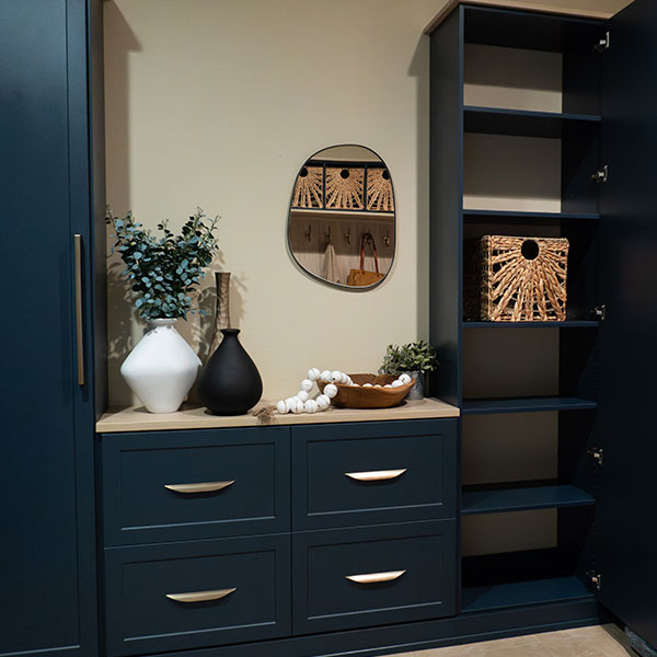 custom-mudroom-storage-rocky-mountain-shutters-shades-closets Custom mudroom with navy cabinetry, drawers, and built-in storage