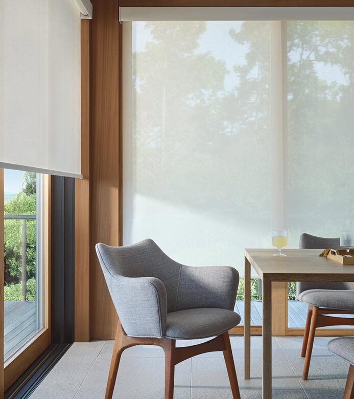 designer-screen-shades-for-floor-to-ceiling-windows-in-mid-century-modern-dining-room-rocky-mountain-shutters-shades-and-closets screen shades on living room window rocky mountain shutters shades and clsoets